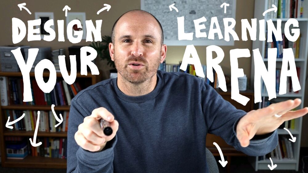 Doug Neill standing in front of bookshelves, holding a marker toward the camera with one hand and gesturing openly with the other. Hand-drawn white text surrounds him reading 'Design Your Learning Arena' with playful arrows pointing outward in all directions.